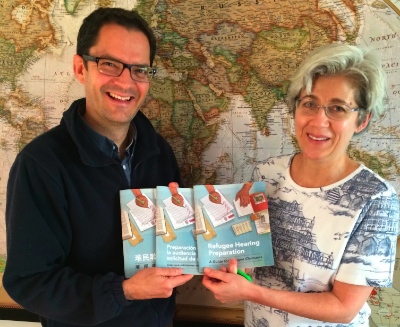 Loren Balisky and Fran Gallo with copies of the Refugee Hearing Preparation Guides.