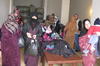 Clothing distribution for Muslim Syrian refugees in the south of Lebanon near Sidon.  Photo by James Grunau.