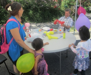 Pastor Fred Rink spent the afternoon making balloon animals for children at Bethlehem Lutheran Church's July 4 block party.