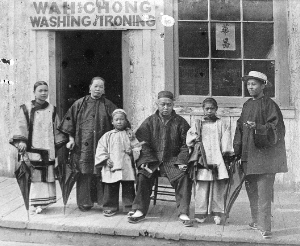 The Wah Chong family outside their laundry business on Water Street in 1884. Vancouver Archives: AM54-S4-: SGN 435.1